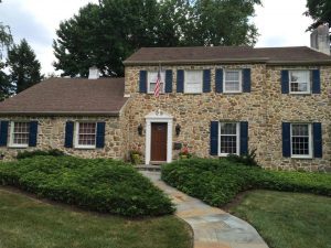 Exterior Brighten Stone Home With Fresh Paint On Shutters And Front Door 1