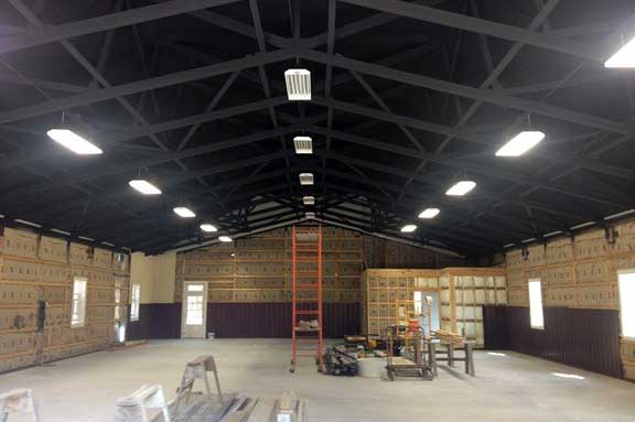 Airplaine hangar after painting ceiling black. 